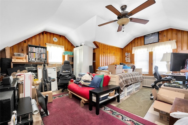 carpeted bedroom with lofted ceiling, wood walls, and radiator heating unit