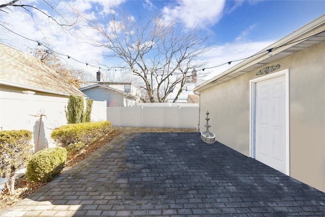 view of patio / terrace featuring fence