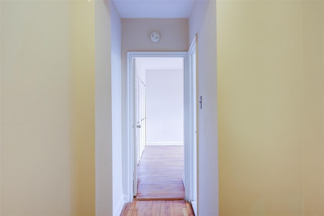 corridor with light wood-style floors