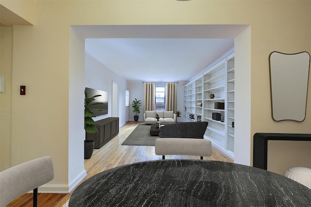 living area featuring wood finished floors and baseboards