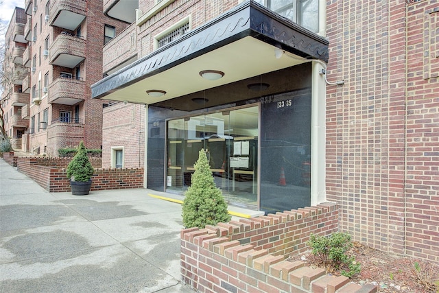 entrance to property with brick siding