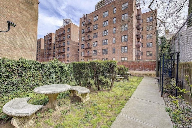 view of property with fence