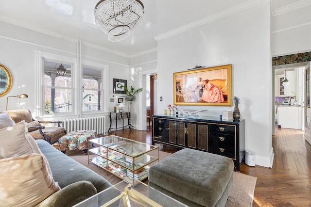 living area with crown molding, radiator, a chandelier, baseboards, and hardwood / wood-style flooring