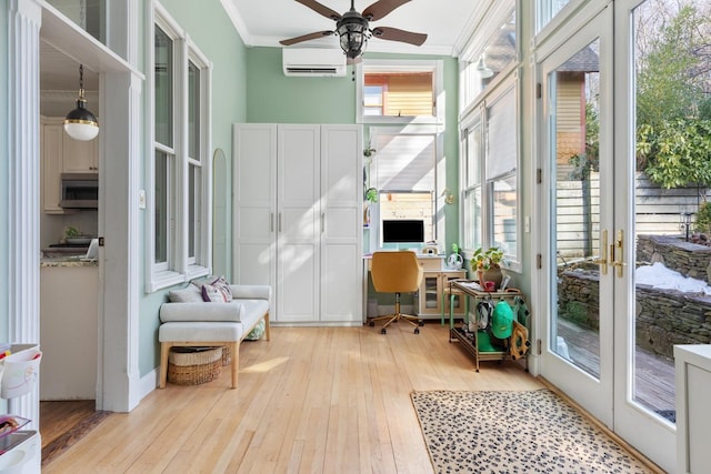 sunroom / solarium with a ceiling fan, a wealth of natural light, french doors, and a wall mounted AC