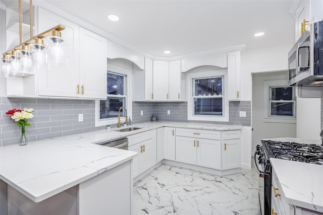 kitchen featuring decorative backsplash, marble finish floor, stainless steel appliances, white cabinetry, and a sink