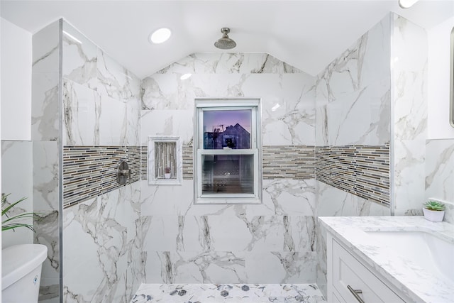 full bath with toilet, a marble finish shower, vaulted ceiling, and vanity