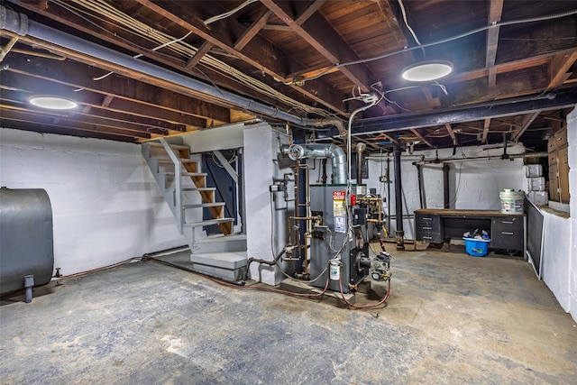 unfinished basement featuring heating fuel and stairs