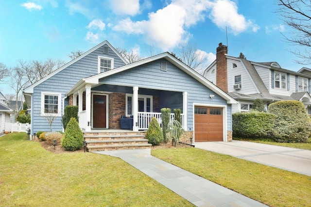 view of front of property featuring a garage, concrete driveway, a chimney, a porch, and a front yard