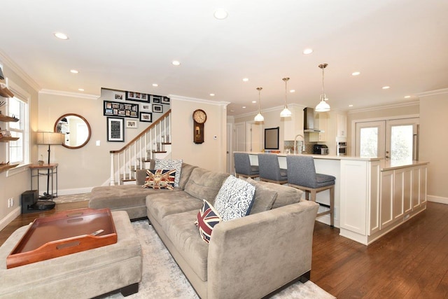 living room featuring ornamental molding, stairway, dark wood finished floors, and baseboards