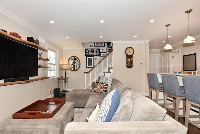 living area with recessed lighting, wood finished floors, baseboards, stairway, and crown molding