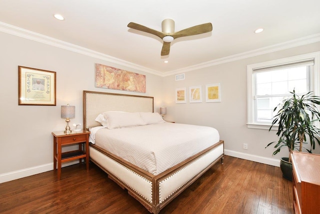 bedroom with ornamental molding, visible vents, baseboards, and wood finished floors