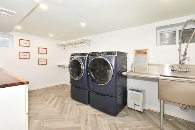 laundry area with recessed lighting, visible vents, separate washer and dryer, laundry area, and baseboards