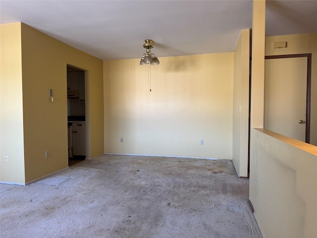 unfurnished room with light colored carpet