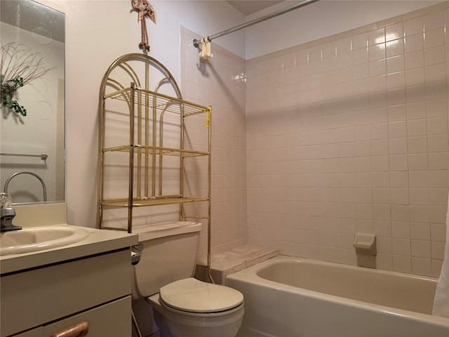 full bath featuring toilet, bathtub / shower combination, and vanity