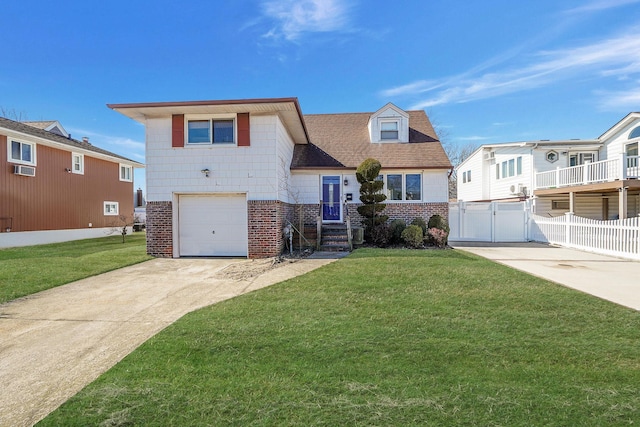 view of front facade with a gate, a front lawn, concrete driveway, and brick siding