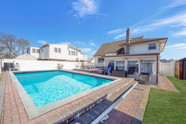 view of pool with a fenced backyard, a fenced in pool, and a patio