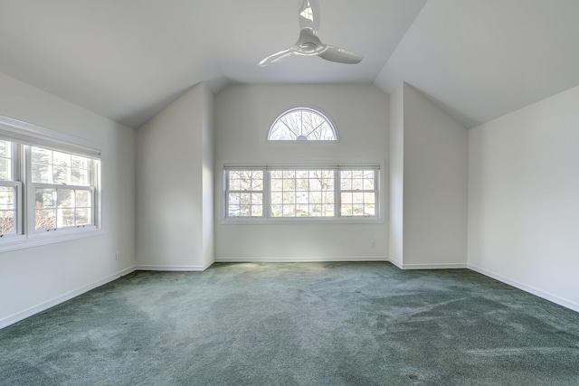 additional living space featuring lofted ceiling, carpet, baseboards, and ceiling fan