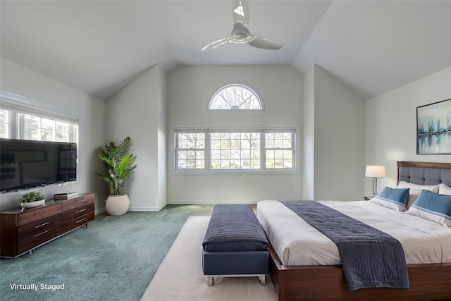 carpeted bedroom featuring a ceiling fan, vaulted ceiling, and baseboards