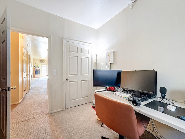 office area with light colored carpet and baseboards