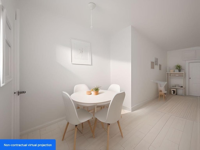 dining area featuring baseboards