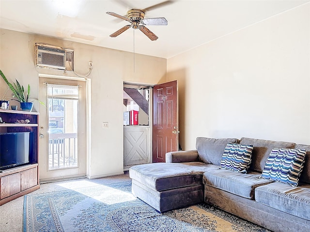 carpeted living room featuring ceiling fan and a wall mounted AC