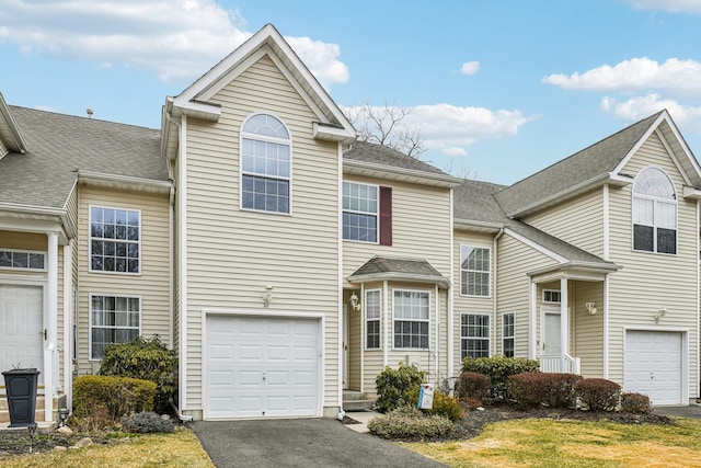 traditional home with a garage and driveway