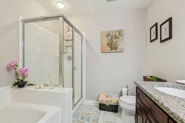 full bath with tile patterned floors, toilet, vanity, a shower stall, and a bath