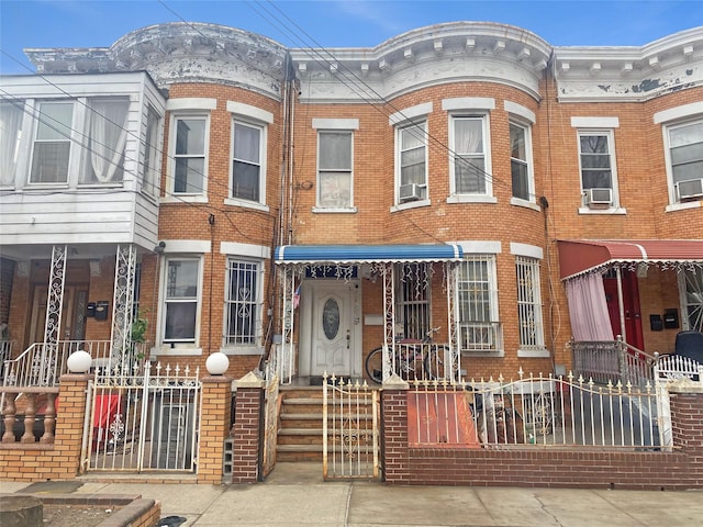 multi unit property with cooling unit and brick siding