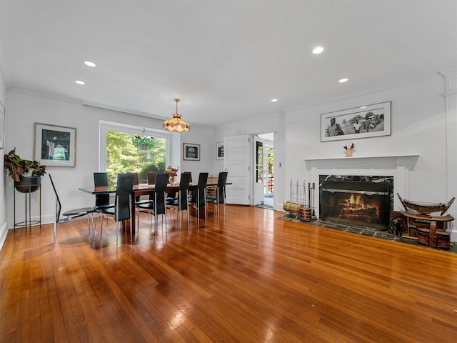 1 Finnegan Ln, Montebello, NY 10901 - dining area featuring a fireplace, crown molding, wood finished floors, and recessed lighting