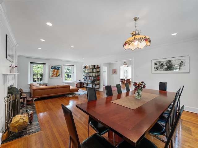1 Finnegan Ln, Montebello, NY 10901 - dining area with a fireplace, light wood finished floors, recessed lighting, and crown molding