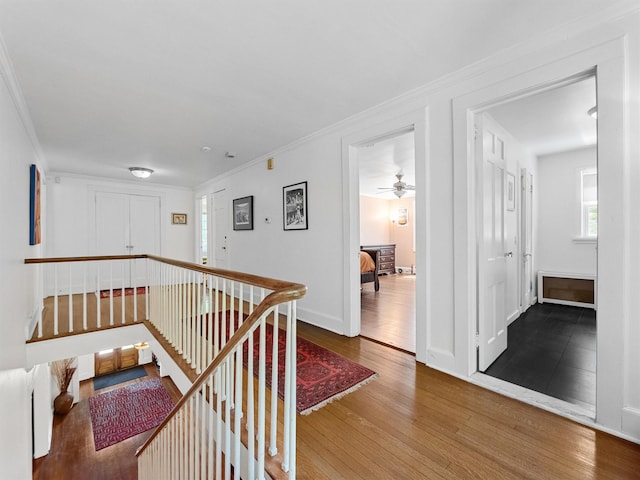 1 Finnegan Ln, Montebello, NY 10901 - hallway with an upstairs landing, wood finished floors, and ornamental molding