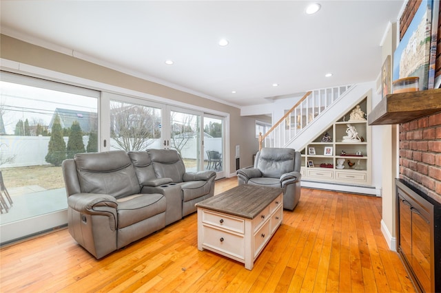 living room featuring recessed lighting, stairs, ornamental molding, baseboard heating, and light wood finished floors