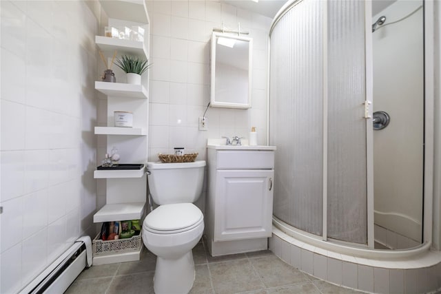 full bathroom featuring tile walls, toilet, a baseboard heating unit, a shower stall, and vanity