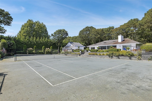 view of tennis court with fence