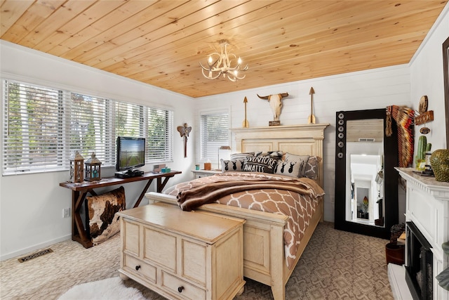 bedroom with carpet floors, visible vents, a chandelier, wooden ceiling, and baseboards