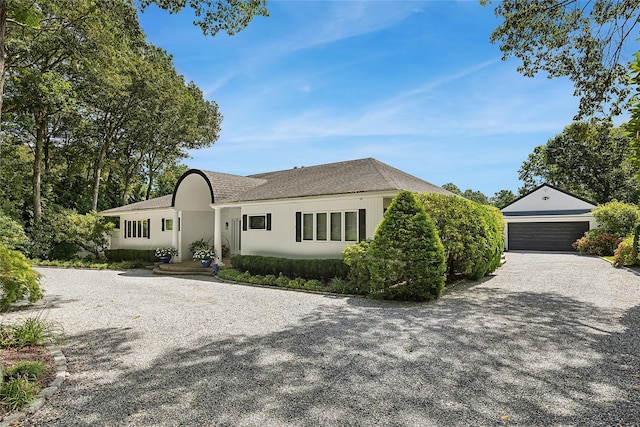 ranch-style home with an outbuilding and a detached garage