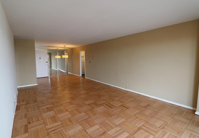 empty room featuring baseboards