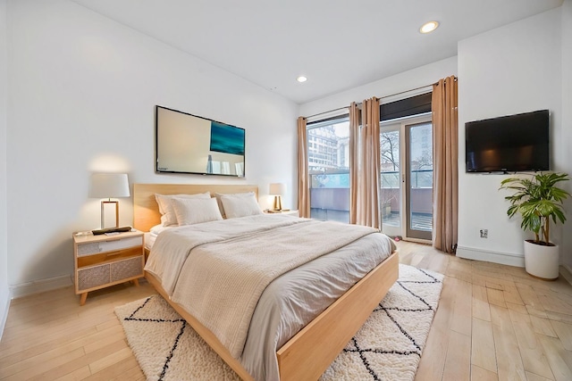 bedroom with light wood finished floors, access to outside, baseboards, and recessed lighting