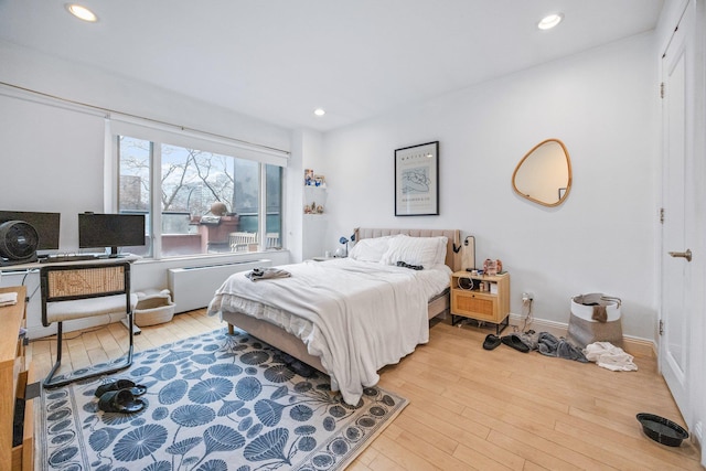 bedroom featuring recessed lighting, baseboards, and hardwood / wood-style flooring