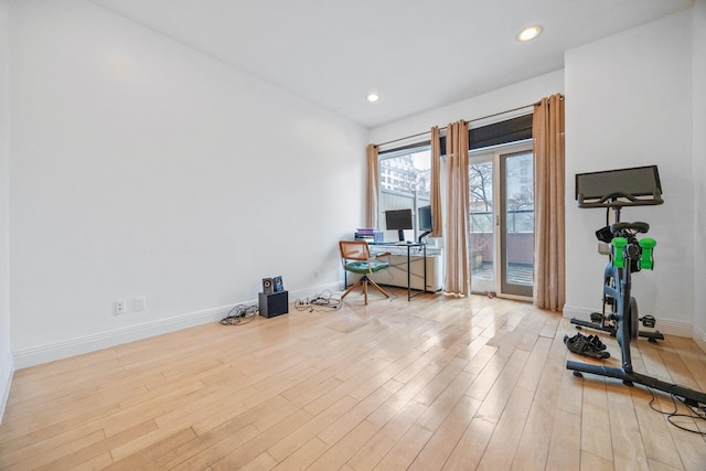office space with recessed lighting, wood finished floors, and baseboards