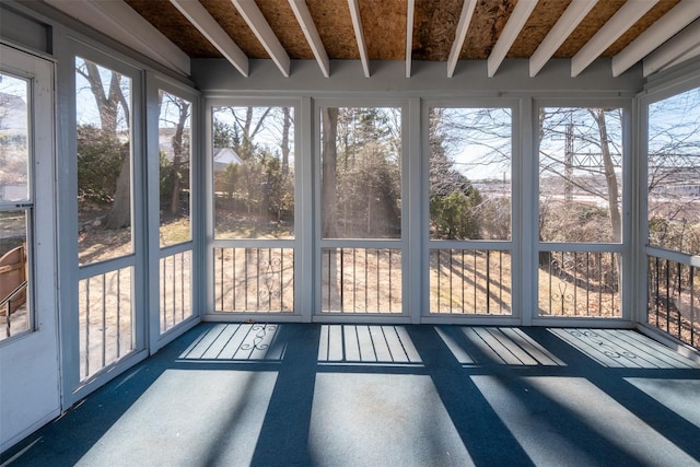 unfurnished sunroom featuring a wealth of natural light