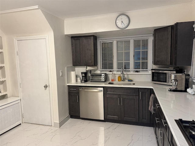 kitchen with a sink, marble finish floor, ornamental molding, appliances with stainless steel finishes, and radiator heating unit