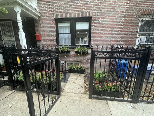 view of exterior entry with brick siding