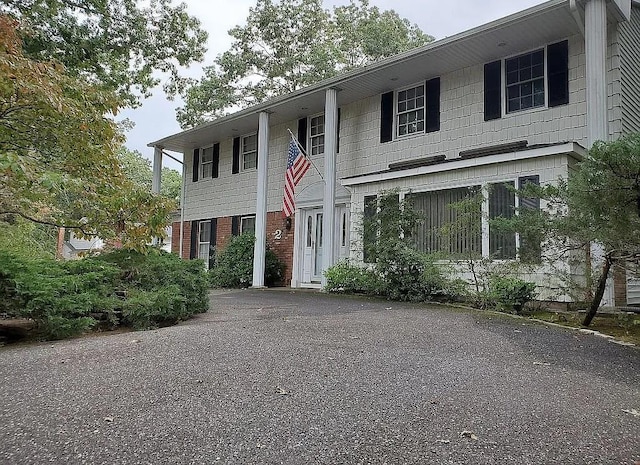 view of front of property featuring brick siding