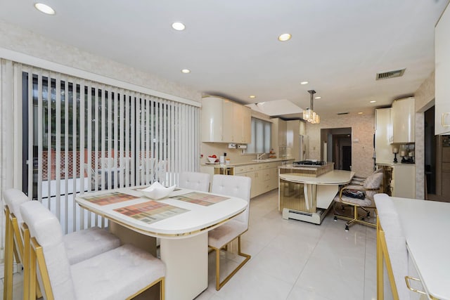 dining room with light tile patterned flooring, visible vents, and recessed lighting