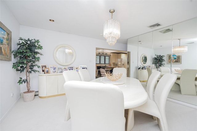 dining area with visible vents, a notable chandelier, and light colored carpet