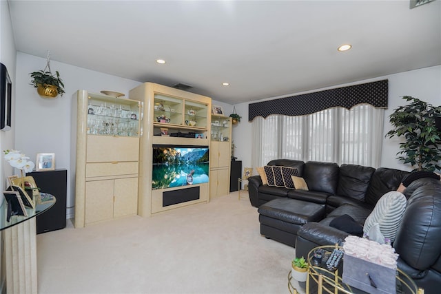 living area featuring recessed lighting, carpet, and visible vents