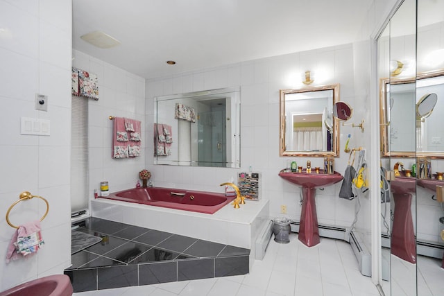 full bath with tile walls, a bath, tile patterned floors, and a baseboard radiator