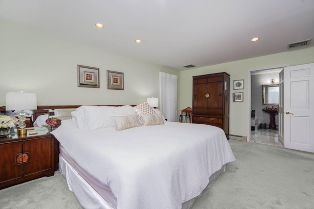 bedroom with recessed lighting, visible vents, light colored carpet, and a baseboard radiator