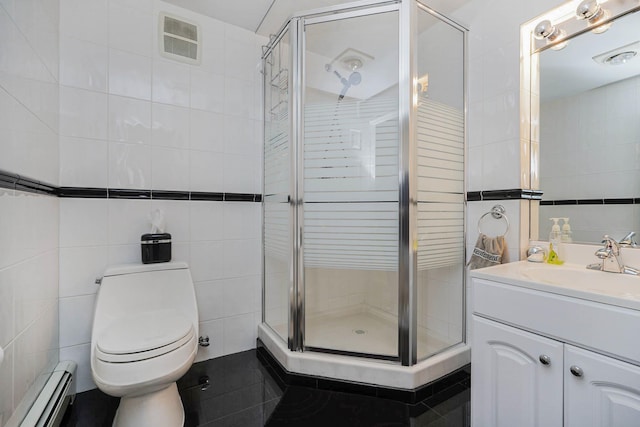 full bathroom with visible vents, tile walls, a baseboard heating unit, a stall shower, and vanity